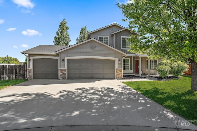 868 S Wiston Pl, Kuna, ID 83634 - view of front of home featuring a garage, concrete driveway, and a porch