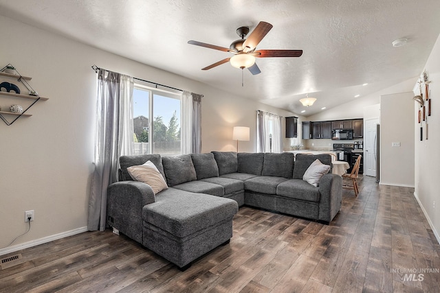 868 S Wiston Pl, Kuna, ID 83634 - living area featuring dark wood finished floors, ceiling fan, lofted ceiling, baseboards, and a textured ceiling