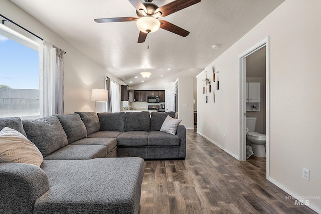 868 S Wiston Pl, Kuna, ID 83634 - living room with ceiling fan, dark wood-style flooring, baseboards, lofted ceiling, and recessed lighting