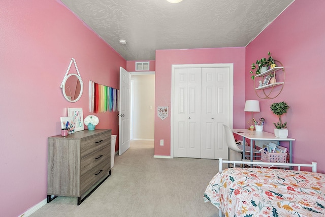 868 S Wiston Pl, Kuna, ID 83634 - bedroom featuring light carpet, a closet, baseboards, and a textured ceiling