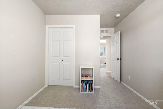 868 S Wiston Pl, Kuna, ID 83634 - unfurnished bedroom with carpet flooring, baseboards, a textured ceiling, and a closet