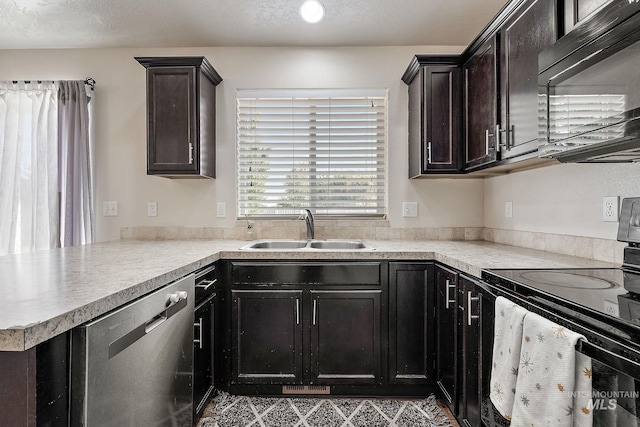 868 S Wiston Pl, Kuna, ID 83634 - kitchen with appliances with stainless steel finishes, a sink, light countertops, and a peninsula