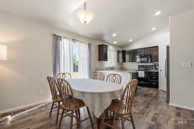 868 S Wiston Pl, Kuna, ID 83634 - dining space featuring dark wood-style flooring, lofted ceiling, baseboards, and recessed lighting