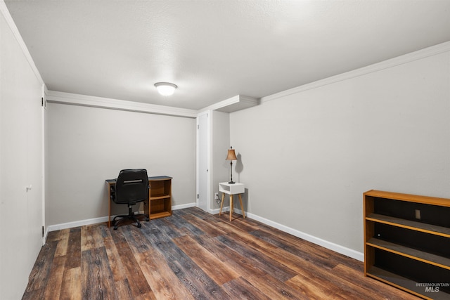 office area with crown molding, baseboards, and wood finished floors