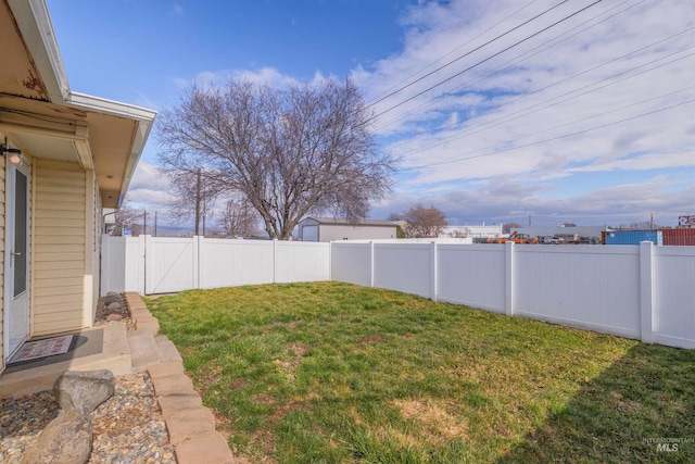 view of yard with a fenced backyard