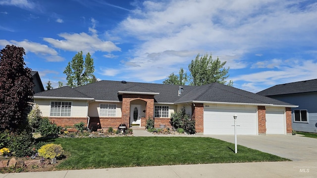 2610 N Sea Cv, Meridian, ID 83646 - view of front of home with brick siding, an attached garage, driveway, and a front yard