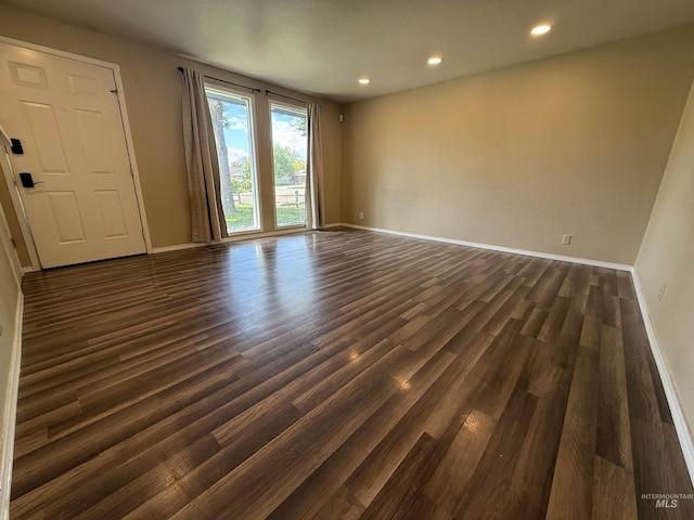 10342 W Ardyce St, Boise, ID 83704 - empty room with baseboards, dark wood-type flooring, and recessed lighting