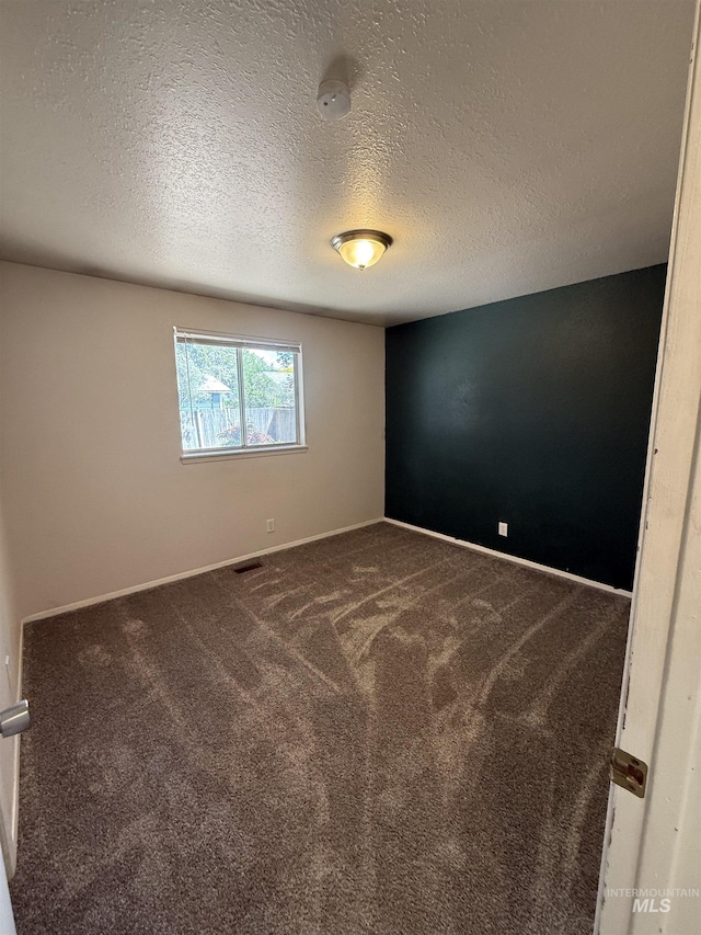 10342 W Ardyce St, Boise, ID 83704 - carpeted empty room featuring baseboards and a textured ceiling