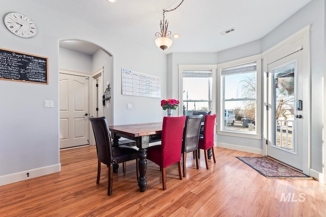 dining area with light wood-type flooring