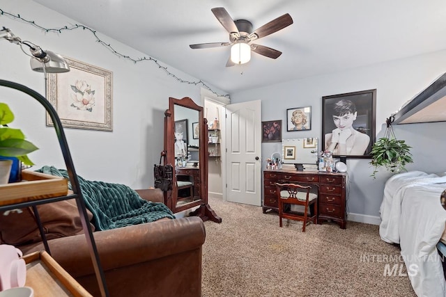 living area with ceiling fan and light carpet