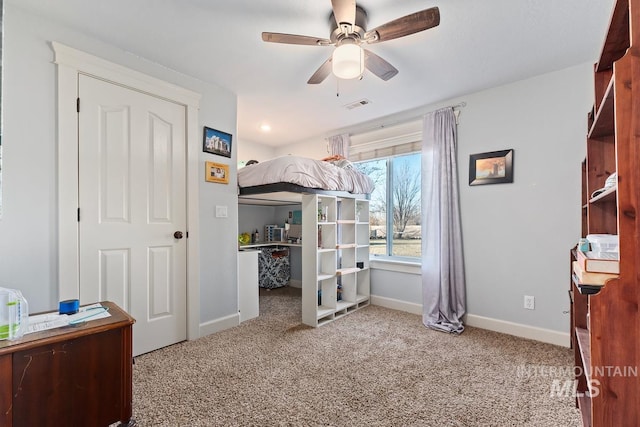 carpeted bedroom with ceiling fan