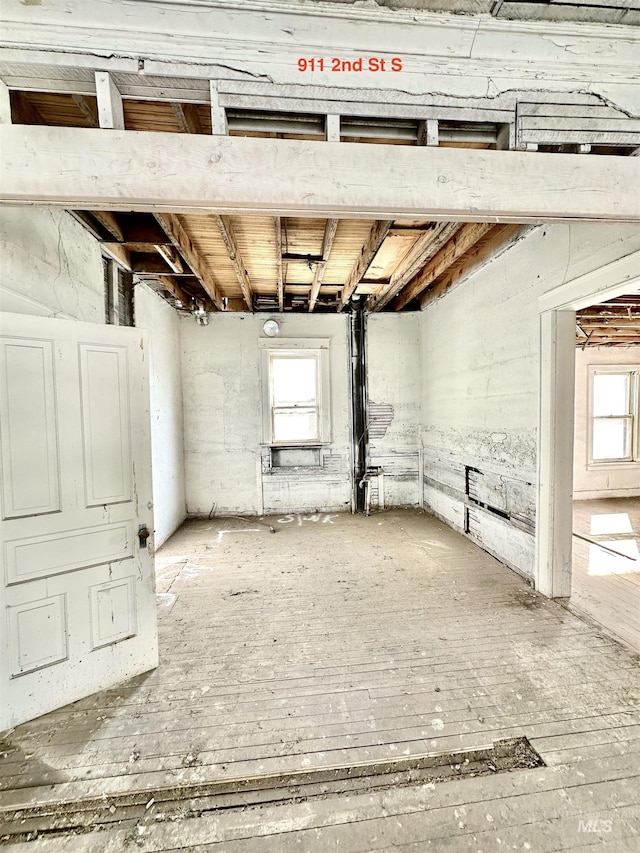 basement with hardwood / wood-style floors