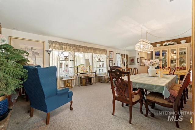23743 Viking Ln, Wilder, ID 83676 - carpeted dining room featuring a chandelier