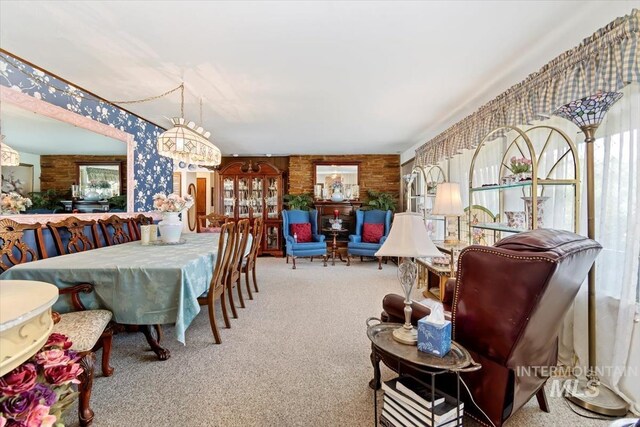 23743 Viking Ln, Wilder, ID 83676 - carpeted dining space with healthy amount of natural light, wallpapered walls, and a chandelier