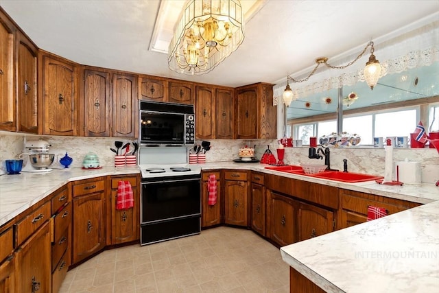 23743 Viking Ln, Wilder, ID 83676 - kitchen featuring black microwave, white electric range, brown cabinetry, and light countertops