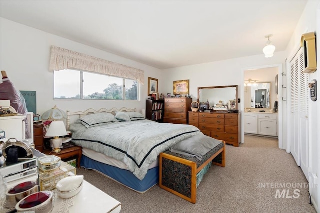 23743 Viking Ln, Wilder, ID 83676 - bedroom featuring light colored carpet and connected bathroom