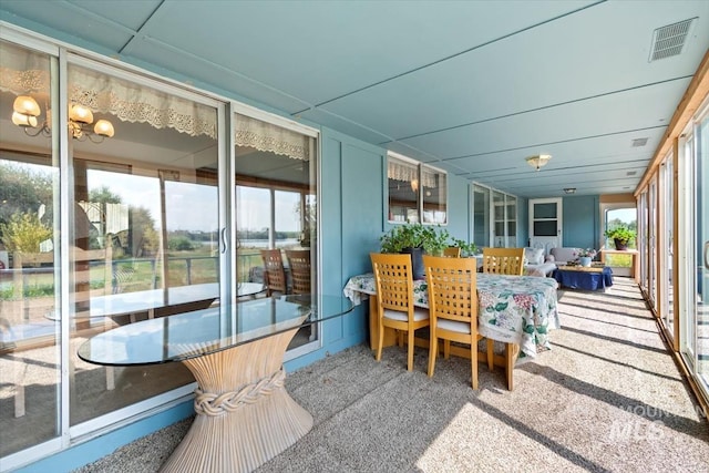23743 Viking Ln, Wilder, ID 83676 - sunroom featuring carpet and outdoor dining space