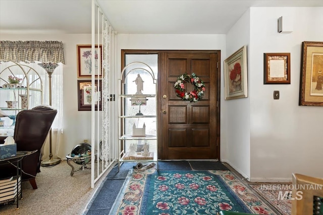 23743 Viking Ln, Wilder, ID 83676 - foyer entrance with carpet flooring and baseboards