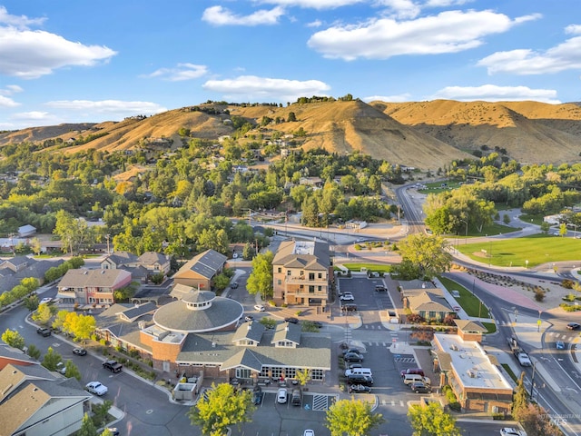 drone / aerial view featuring a residential view and a mountain view