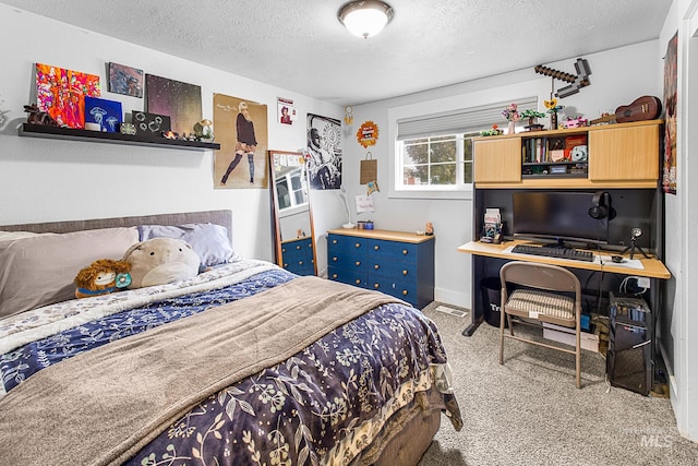 carpeted bedroom featuring a textured ceiling