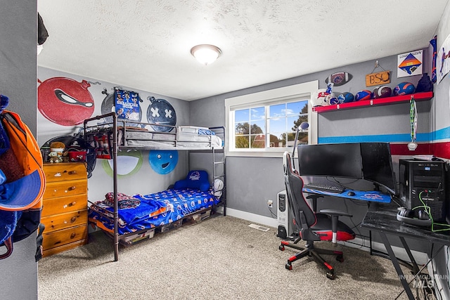 carpeted bedroom featuring a textured ceiling