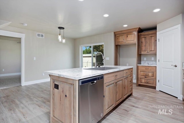 kitchen with a kitchen island with sink, pendant lighting, light wood-type flooring, dishwasher, and sink