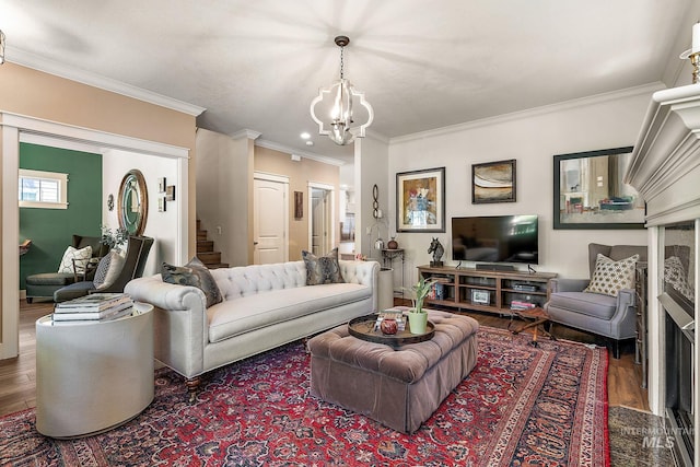 998 E Shadow Creek Ln, Eagle, ID 83616 - living room featuring wood finished floors, a chandelier, ornamental molding, and stairs