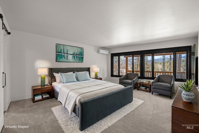 bedroom with multiple windows, carpet floors, a barn door, and a wall mounted AC