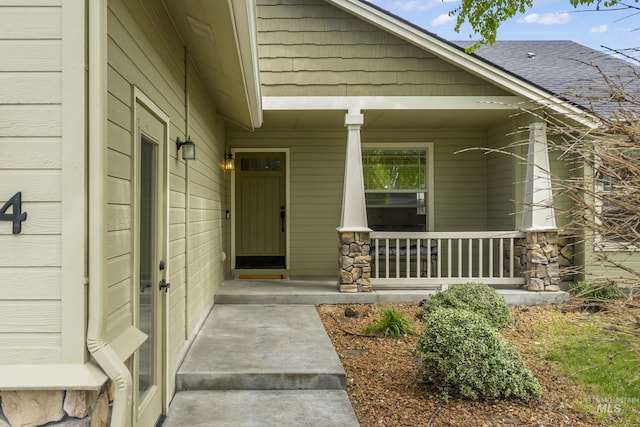 doorway to property featuring a porch