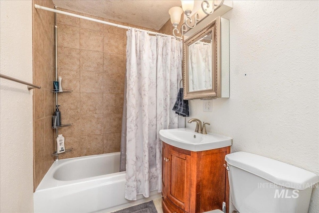 bathroom featuring a sink, toilet, shower / bathtub combination with curtain, and a textured wall