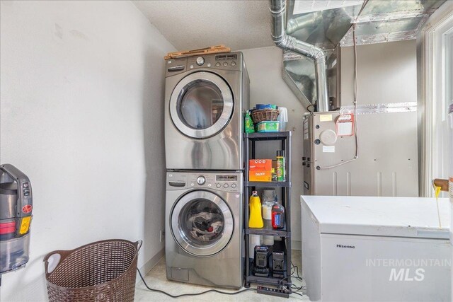 laundry room with estacked washer and dryer