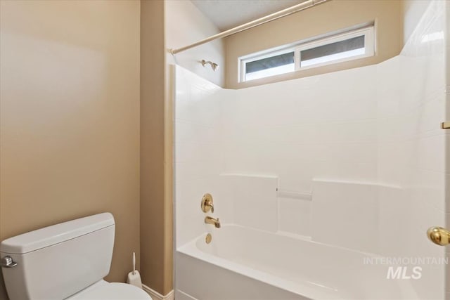 full bath featuring toilet and  shower combination