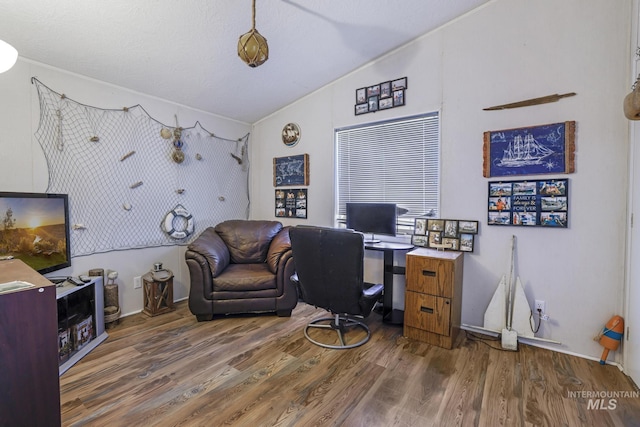 office area featuring lofted ceiling and wood finished floors