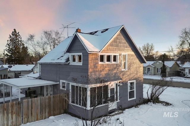 view of snow covered property