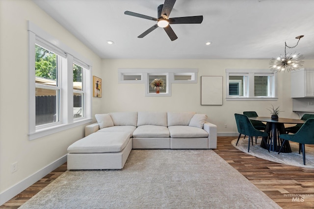 918 N 31st St, Boise, ID 83702 - living area featuring dark wood-style floors, recessed lighting, ceiling fan, and a chandelier