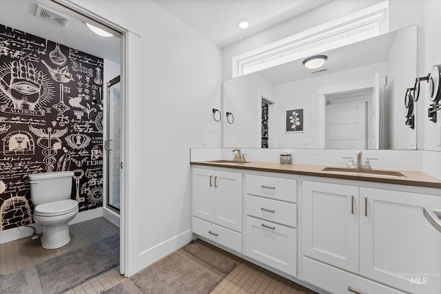 918 N 31st St, Boise, ID 83702 - bathroom featuring double vanity, a stall shower, and tile patterned floors