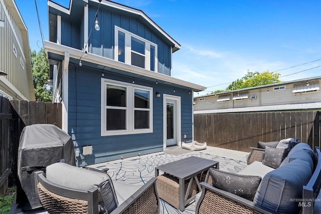 918 N 31st St, Boise, ID 83702 - rear view of property featuring board and batten siding and an outdoor living space