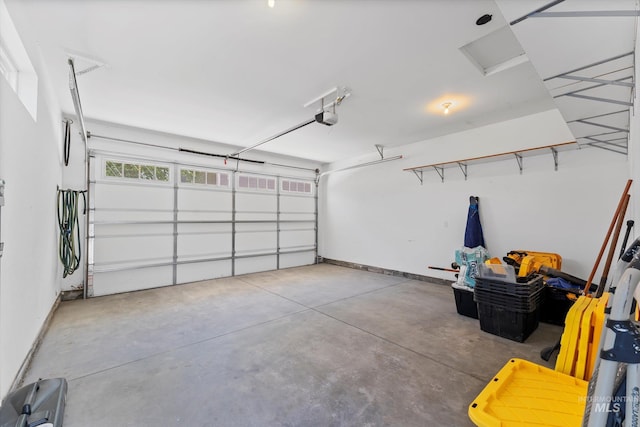 918 N 31st St, Boise, ID 83702 - garage with a garage door opener and baseboards