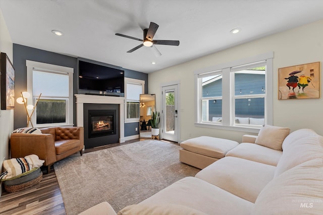 918 N 31st St, Boise, ID 83702 - living room featuring ceiling fan, a glass covered fireplace, wood finished floors, and recessed lighting