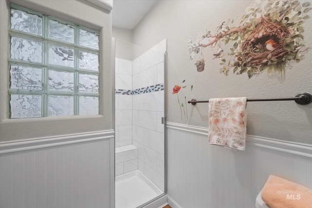 bathroom with tiled shower