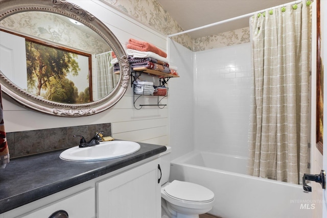 full bathroom with toilet, vanity, and shower / tub combo with curtain