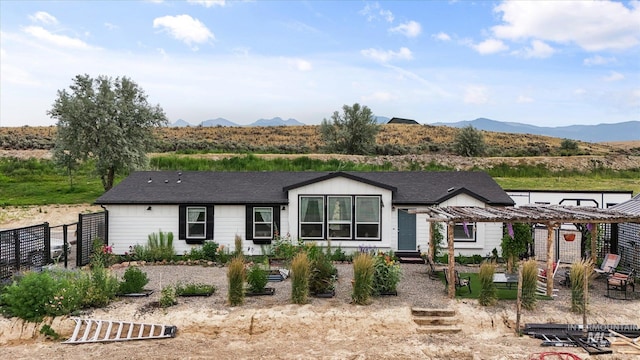 view of front of home featuring a mountain view and a pergola