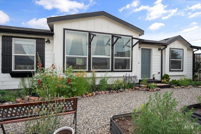 view of front of house with a sunroom