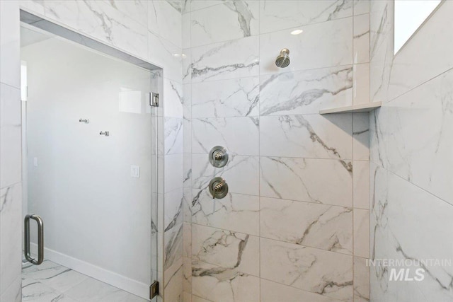 13958 Levendi Ct, Caldwell, ID 83607 - bathroom featuring a marble finish shower, marble finish flooring, and baseboards