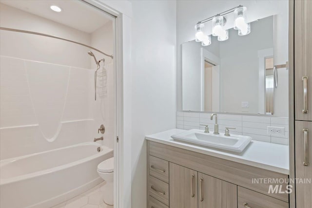 13958 Levendi Ct, Caldwell, ID 83607 - bathroom featuring toilet, vanity, shower / tub combination, and tasteful backsplash