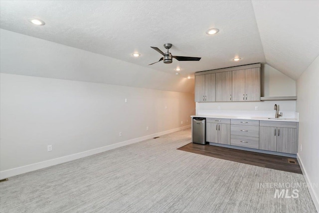 13958 Levendi Ct, Caldwell, ID 83607 - bar area with vaulted ceiling, baseboards, ceiling fan, dark carpet, and recessed lighting