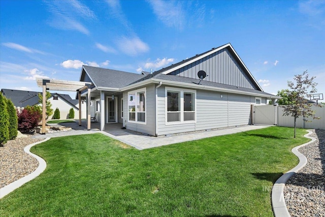 13958 Levendi Ct, Caldwell, ID 83607 - back of property featuring a gate, board and batten siding, a patio, and roof with shingles