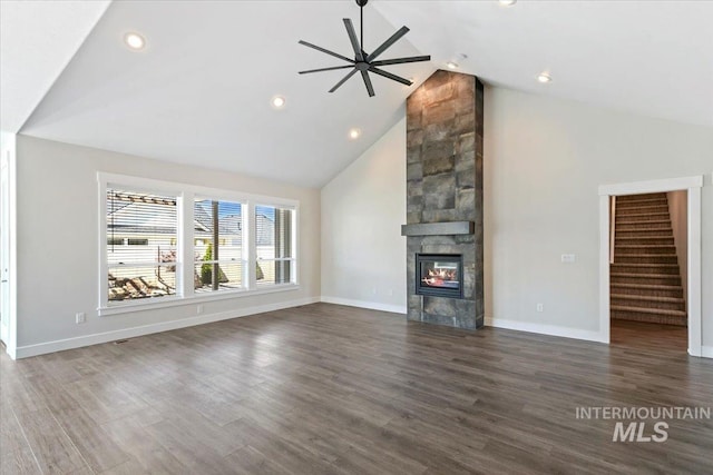 13958 Levendi Ct, Caldwell, ID 83607 - unfurnished living room featuring a fireplace, wood finished floors, high vaulted ceiling, ceiling fan, and stairs