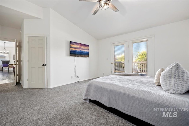 carpeted bedroom featuring access to exterior, baseboards, vaulted ceiling, and ceiling fan with notable chandelier