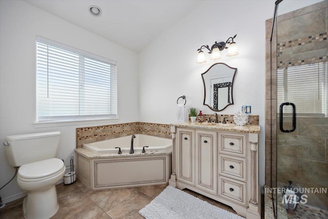 bathroom with a stall shower, toilet, tile patterned floors, vanity, and a bath